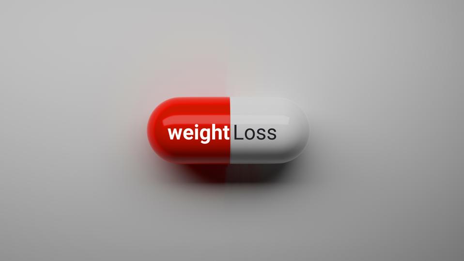 dieting pill on a withe background
