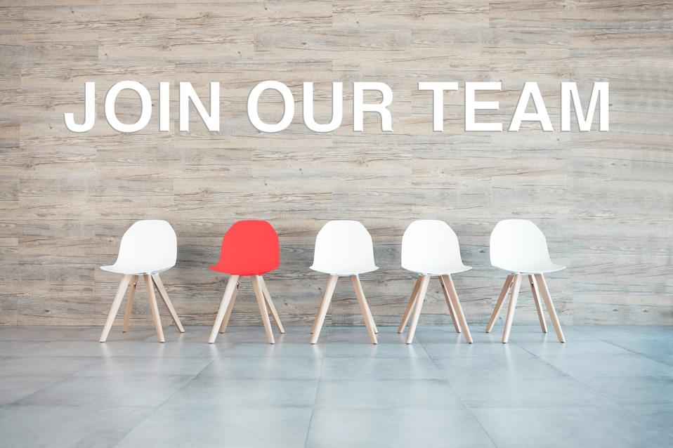 Record the blank queue of chairs during an interview event in the office