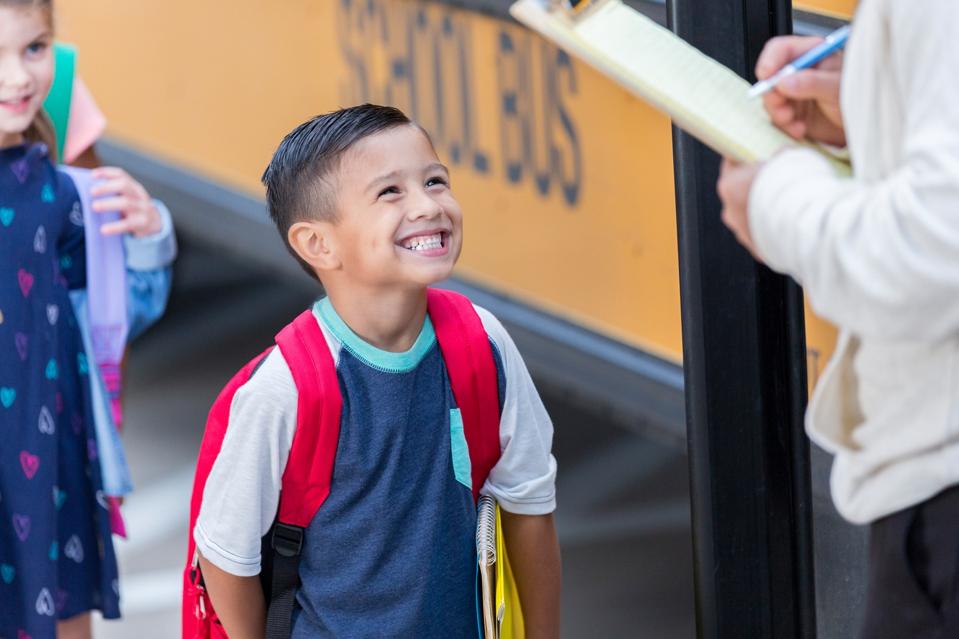 School children board school bus