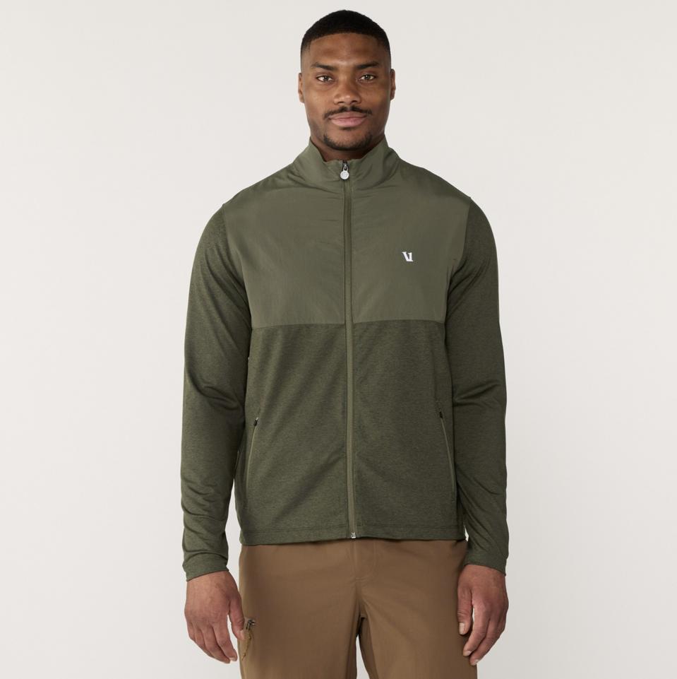 Man wearing the Vuori Sunday Element Track Jacket in Kale Heather.
