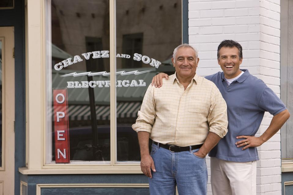 Father and Son in Front of Family Business