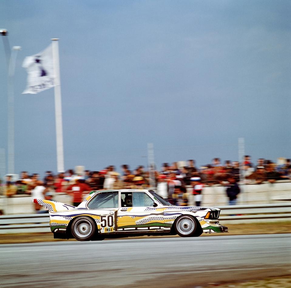 Side profile of BMW 320i Turbo, no. 50, yellow and green and black dotted paintwork