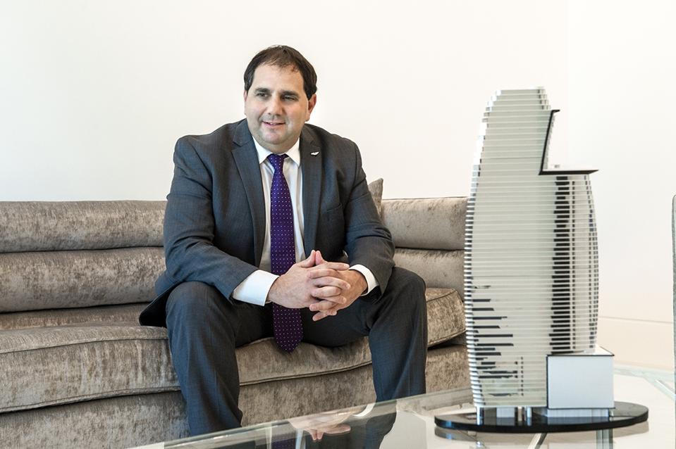 Alejandro Aljanati of Aston Martin Residences Miami, pictured with a scale model 