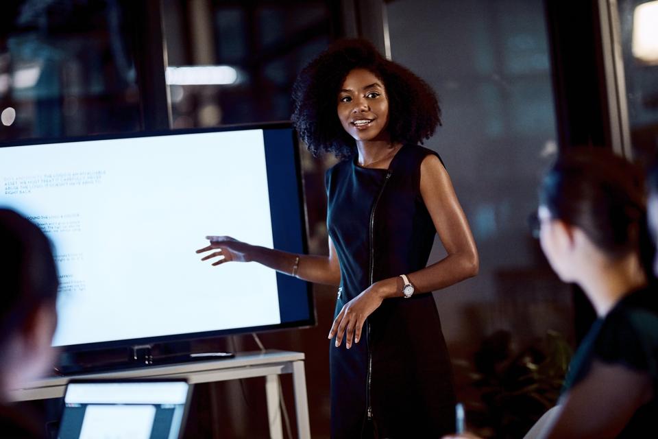 Black woman professional delivering a presentation