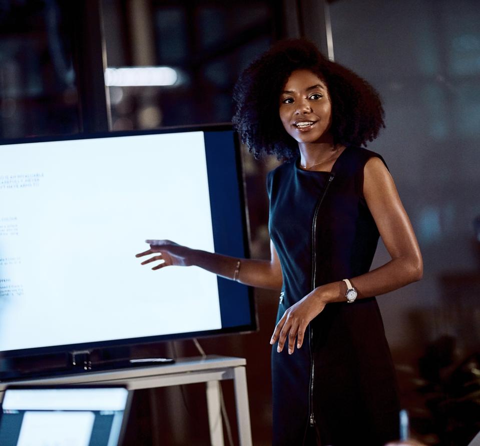 Black woman professional delivering a presentation