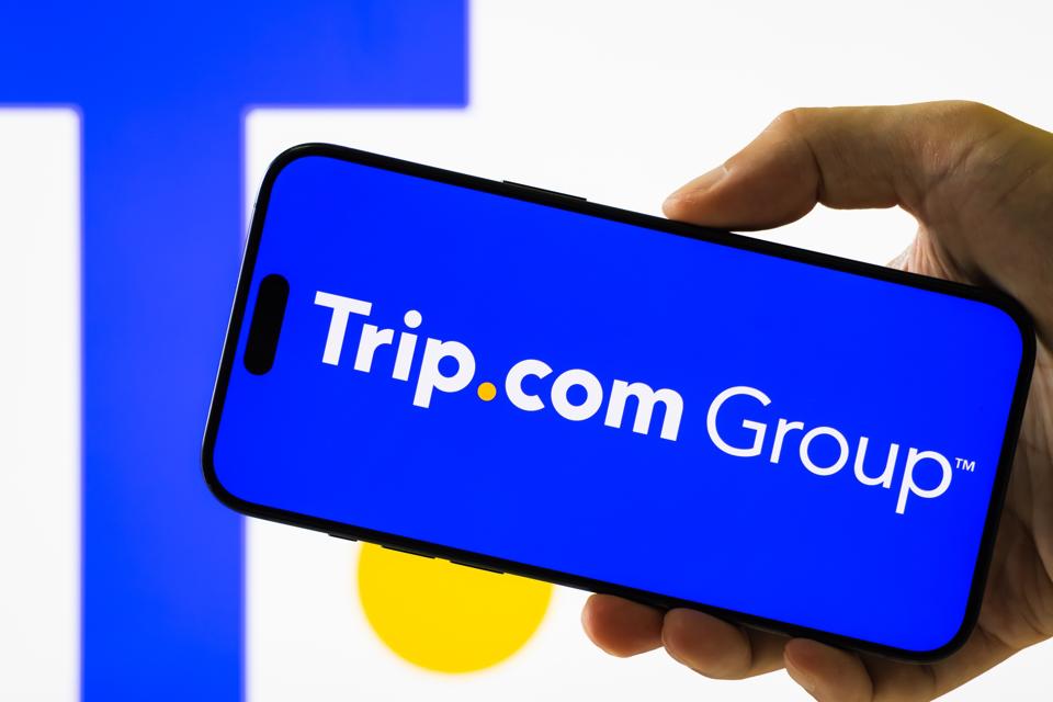 Trip.com Group logo displayed on smartphone screen