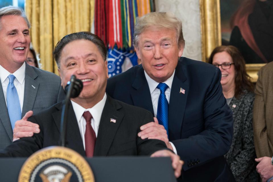 US President Donald Trump jokes with Broadcom CEO Hock Tan  
