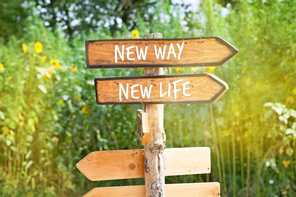 A sign that points 'New Way' and 'New Life' in the same direction