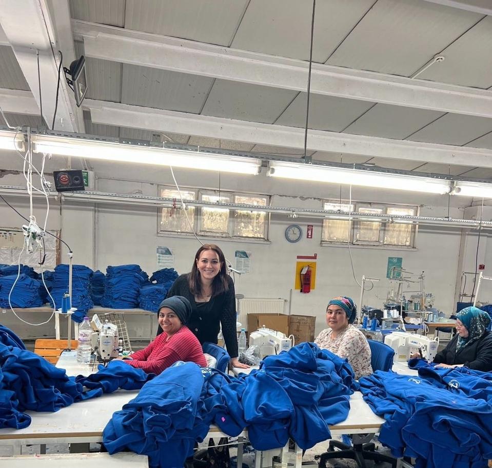  Fadime Öztürk on the factory floor with team members
