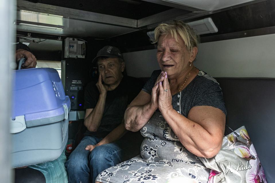Ukrainian emergency service workers evacuate civilians in Kostiantynivka
