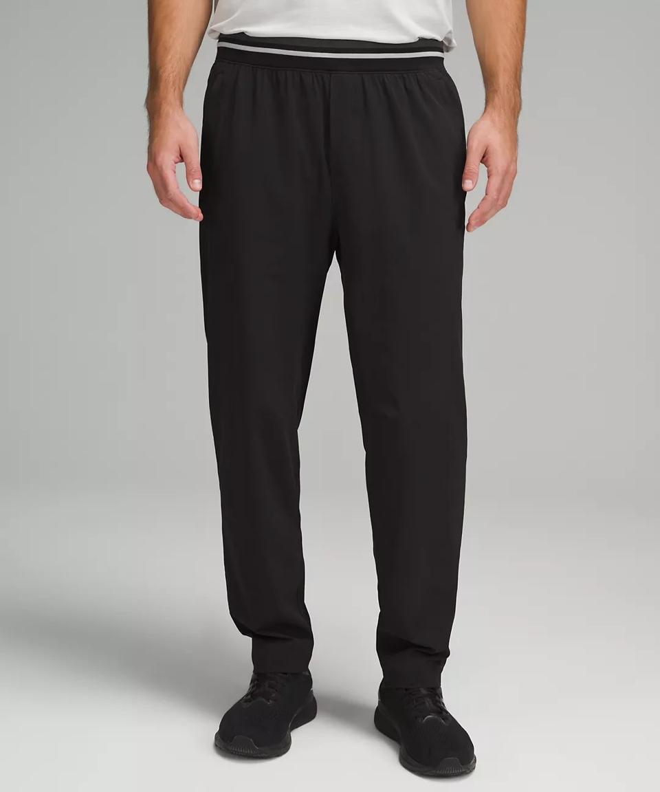 A man wearing a black Lululemon Relaxed-Fit Workout Track Pant