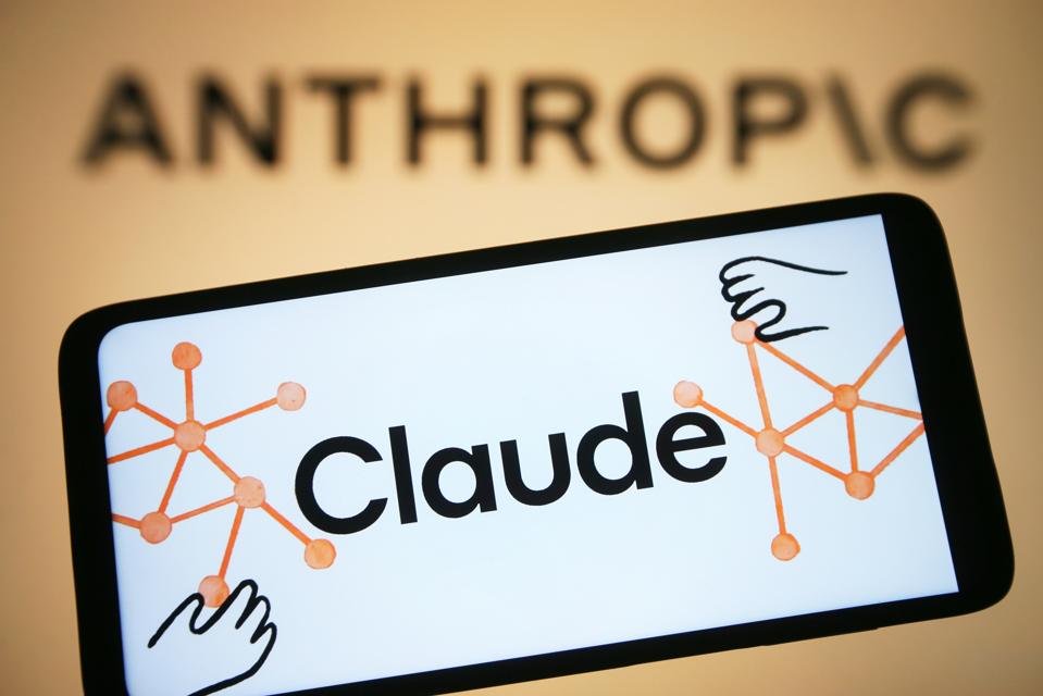 In this photo illustration, Claude AI logo is seen on a...
