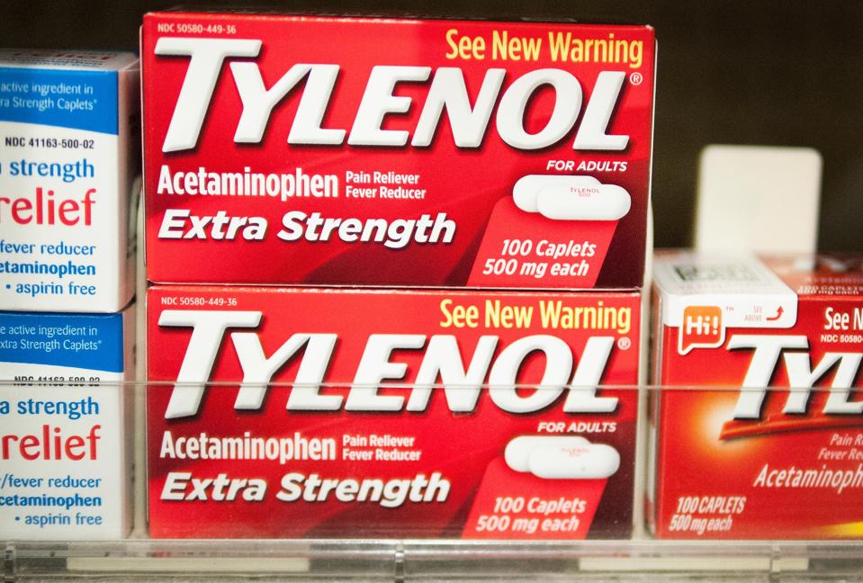 Boxes of Tylenol stacked along aisle in a store