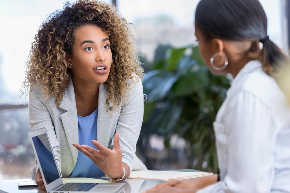 Young woman meets with colleague