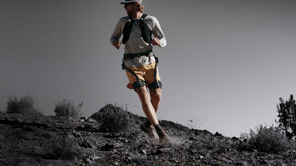 A photo of a man wearing the Hypershell X Ultra exoskeleton.