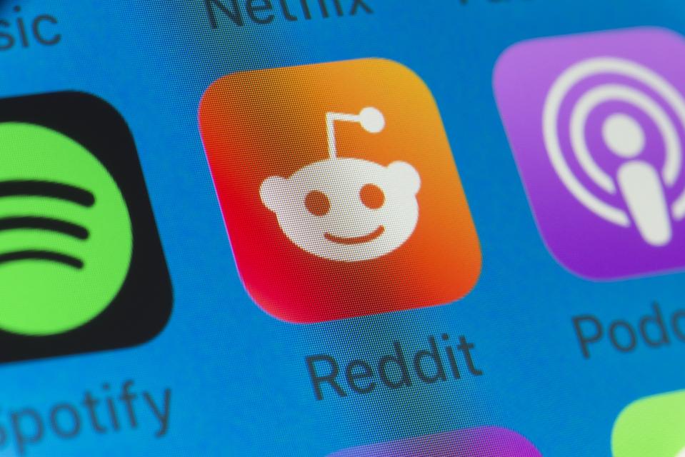 Reddit, Spotify, Podcasts and other cell phone apps on iPhone screen