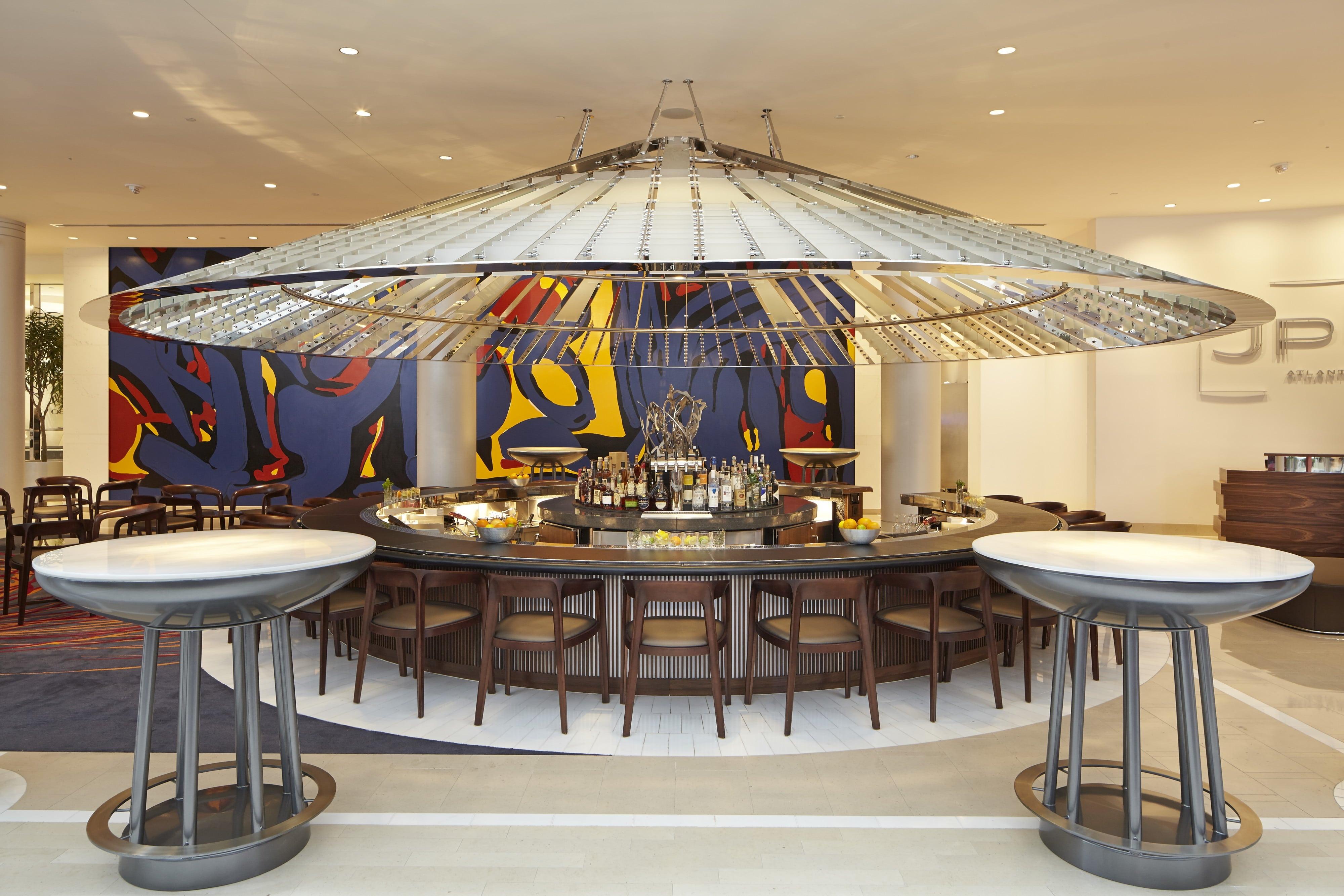 Circular bar surrounded by chairs at Hotel Indigo Atlanta Downtown.