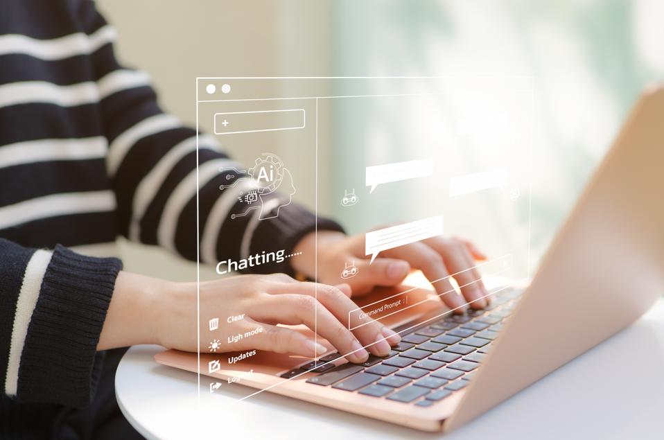 Woman at a computer using ChatGPT prompts to plan a career change.