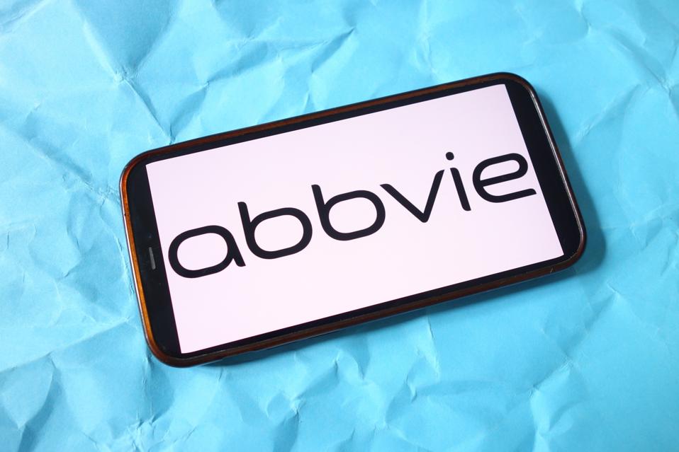 In this photo illustration, the AbbVie company logo is seen...