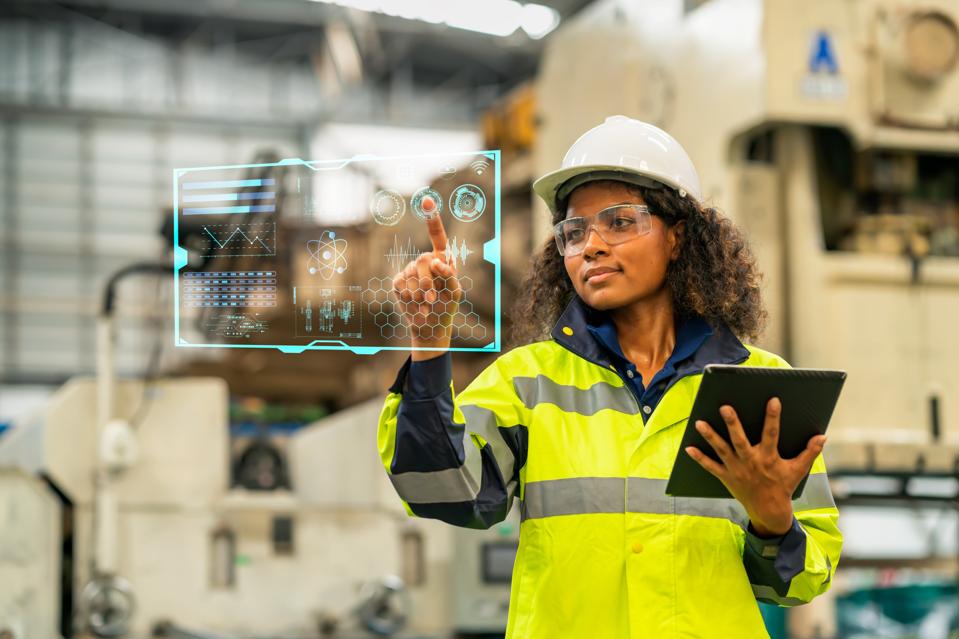 Engineer working on digital tablet & digitalization display.