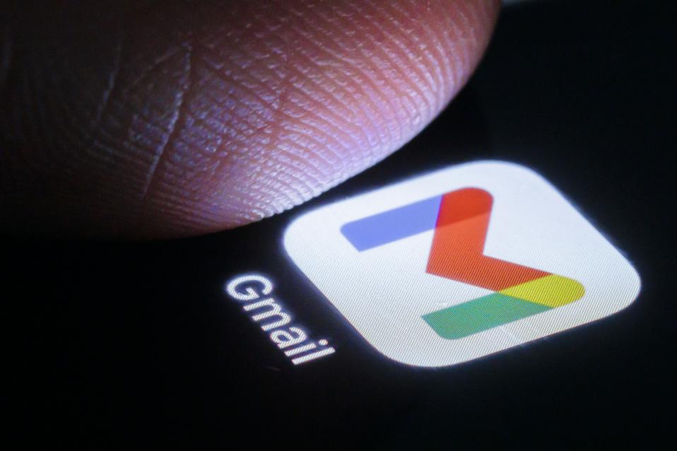 Gmail app under a person's thumb