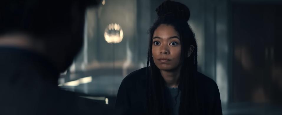 A woman with dark brown braids.