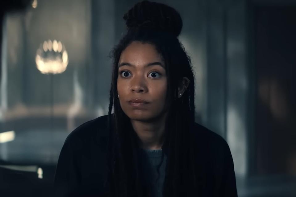 A woman with dark brown braids.