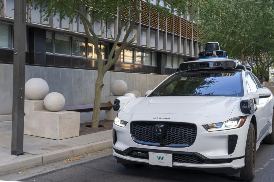 A Waymo’s self-driving Jaguar electric car on the road.  Phoenix, Arizona, USA.
