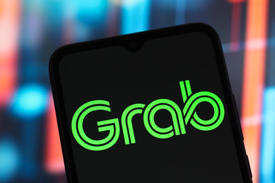 In this photo illustration, the Grab Holdings Limited logo...