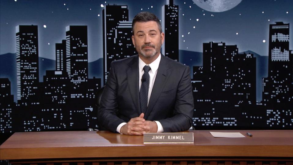 ABC late-night host Jimmy Kimmel seated at a desk