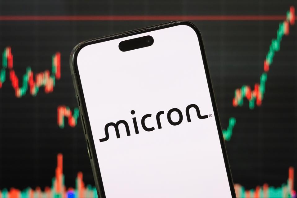 Micron Technology Logo with Stock Chart Displayed on Smartphone