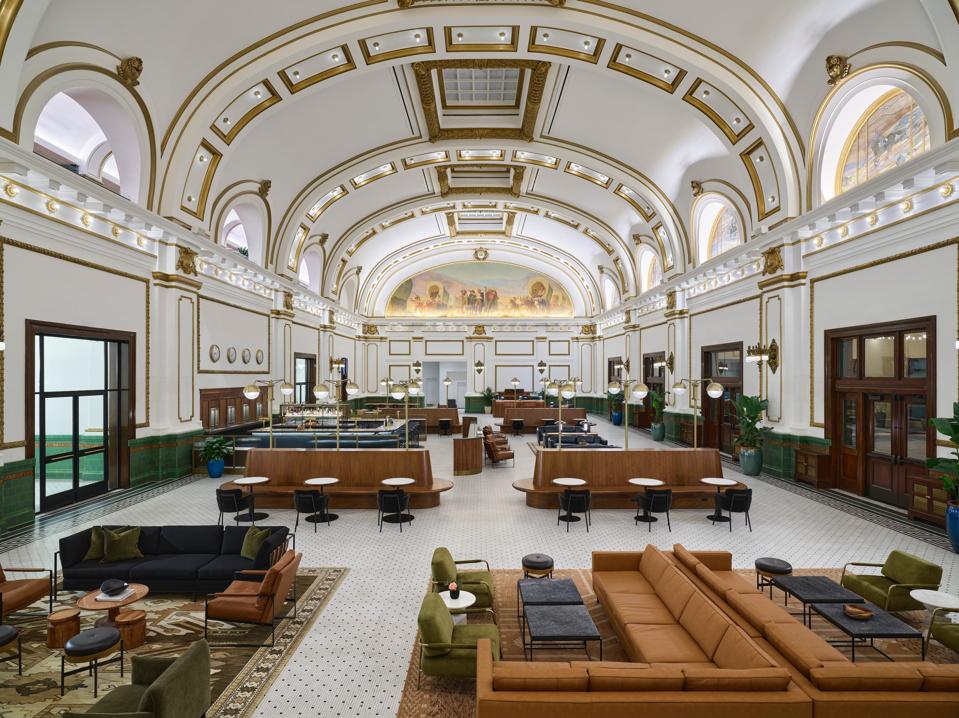 The vaulted Grand Hall of Asher Adams, Autograph Collection renovated beyond its former glory.