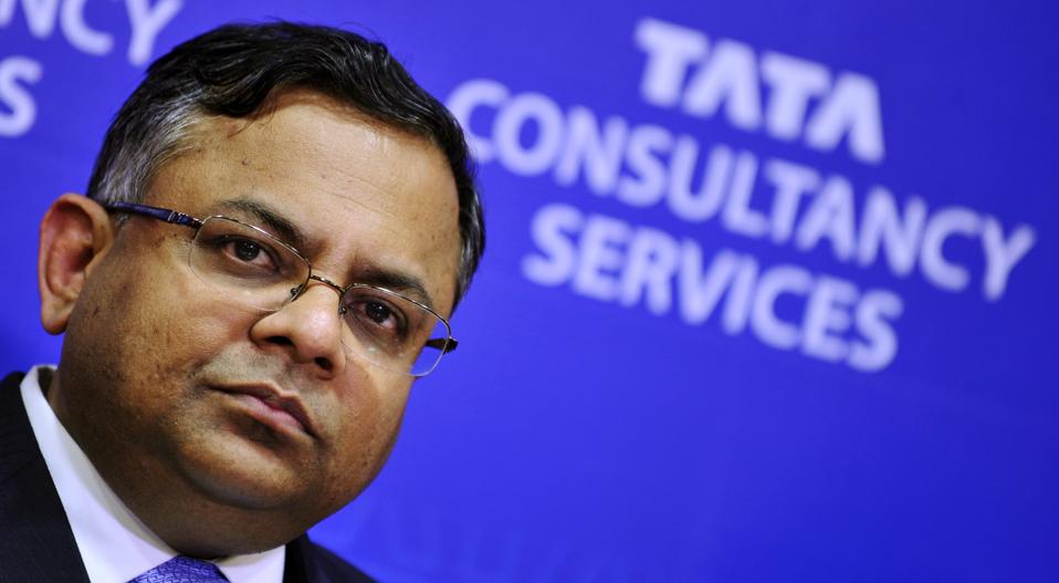 Photo of Natarajan Chandrasekaran, Chair of Tata Sons and Tata Group  with Tata Consultancy Services logo behind him.