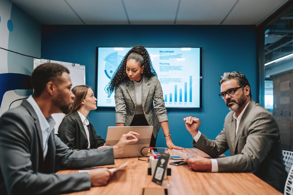 Business woman leading meeting