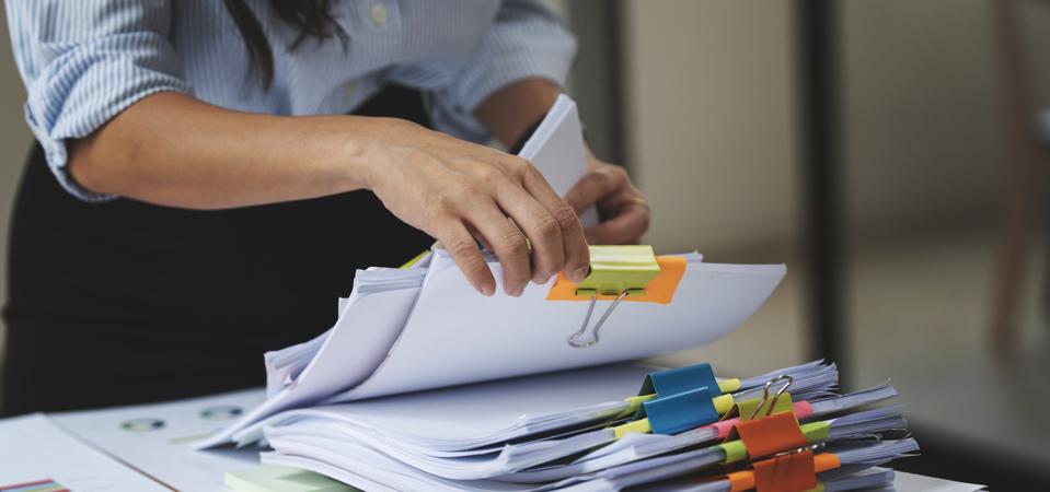 Businesswoman working with paper files