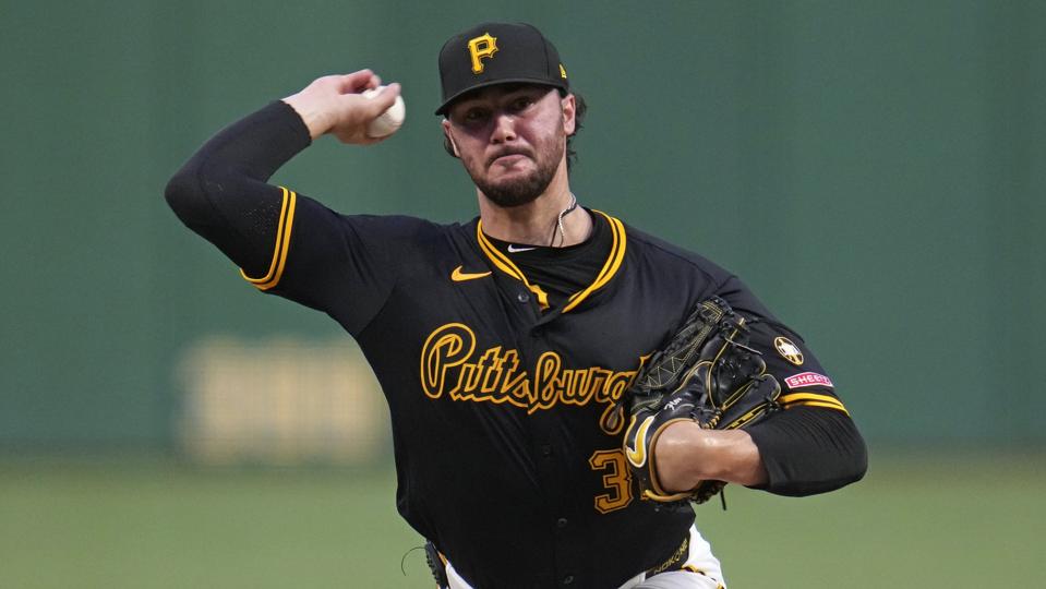 Right-handed pitcher Paul Skenes throwing a pitch.