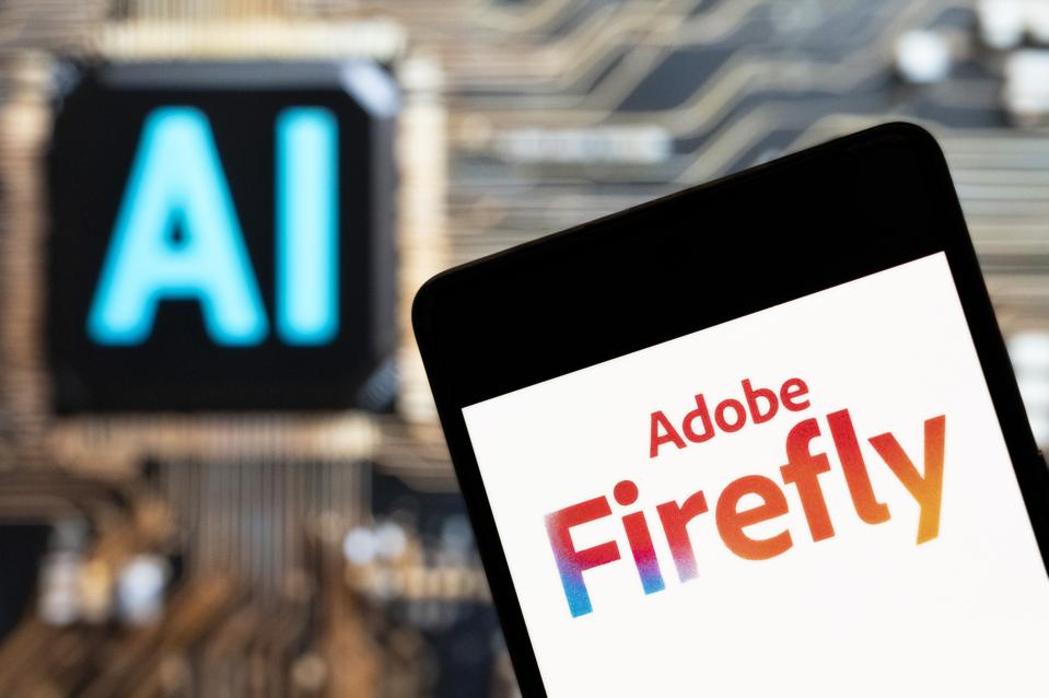 In this photo illustration, the Adobe Firefly logo seen...