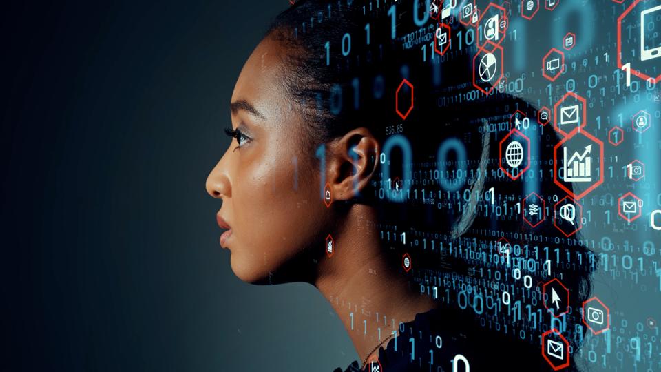 Black woman standing with numbers and technology near her head