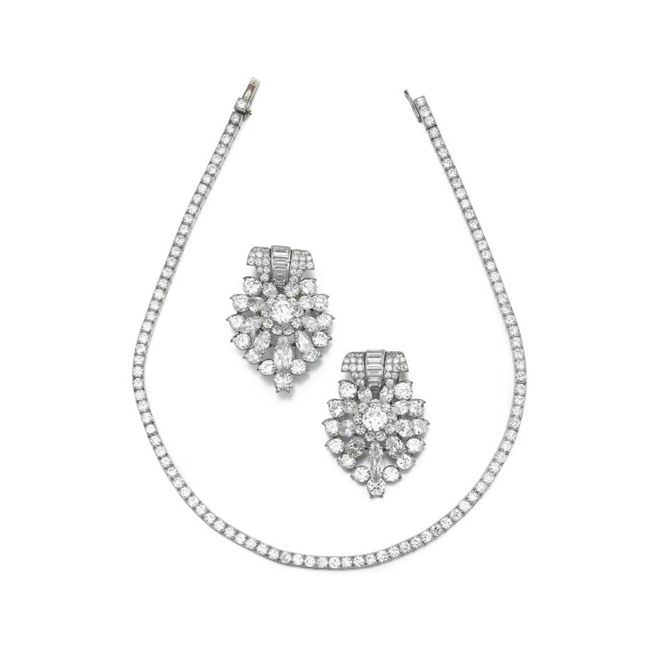 Cartier Paris diamond double clips and diamond necklace. Estimate: $87,769 - $175,538
