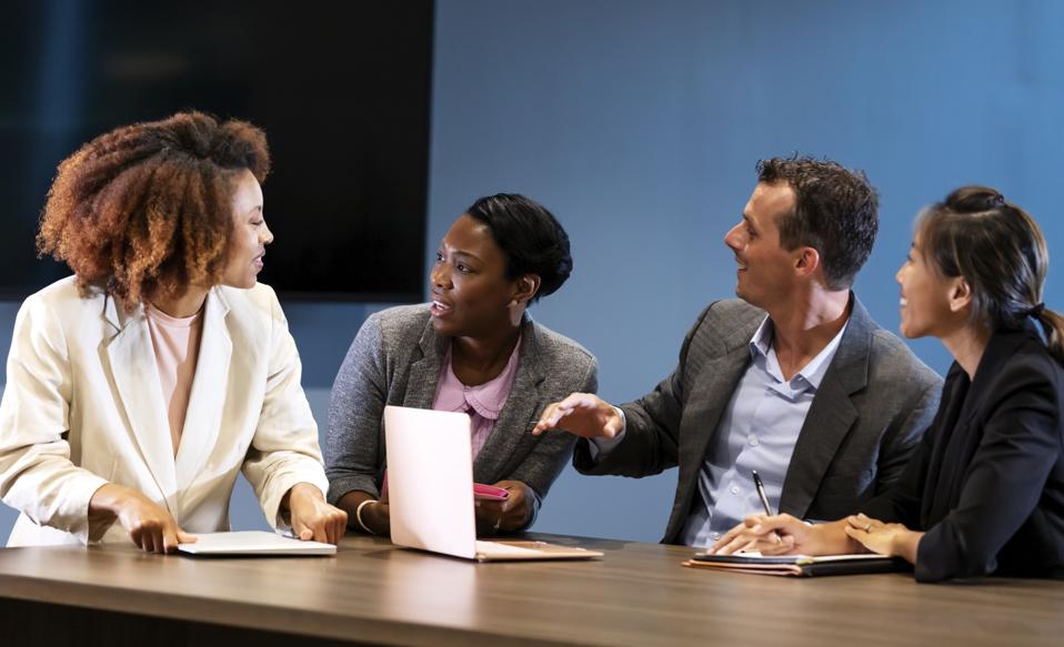 Business people using talking in meeting room showing they have leadership potential