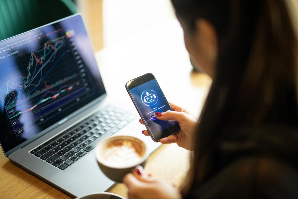 Asian woman using ai assist for analyzing crypto trading graph.