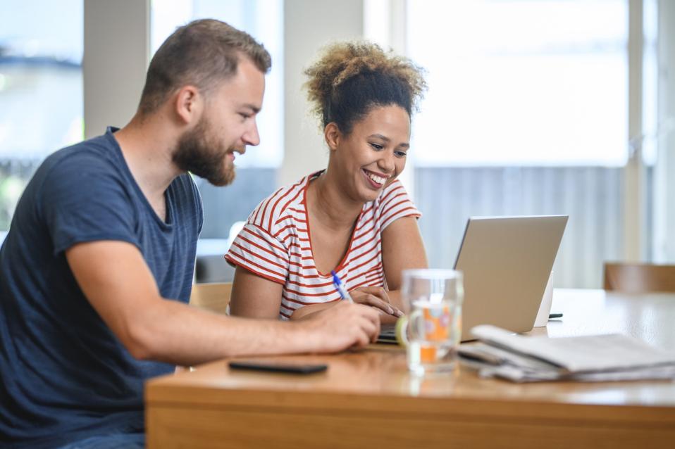 Millennial Couple Discussing Future Home Finance Plans