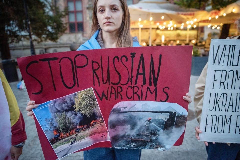 A protester holds a placard expressing her opinion during...