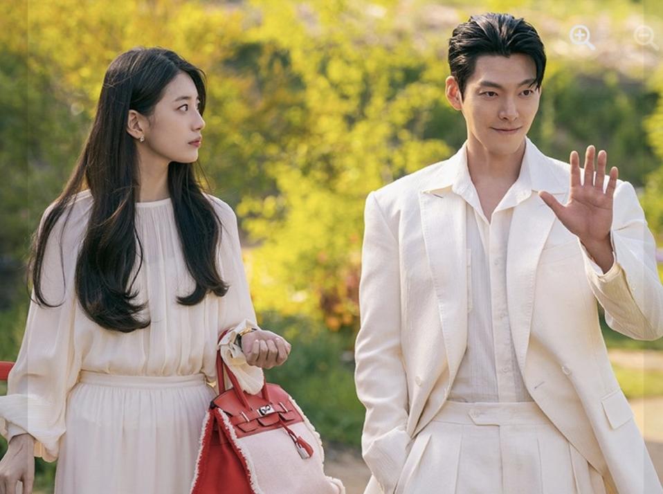 Actress Bae Suzy in a white dress and actor Kim Woo-bin in a white suit.