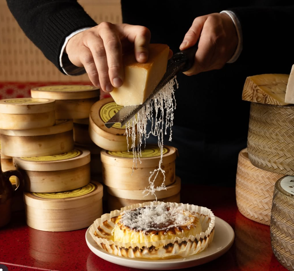 The Basque cheesecake cart at Txula Steak offers a variety of cheeses to grate on top of dessert