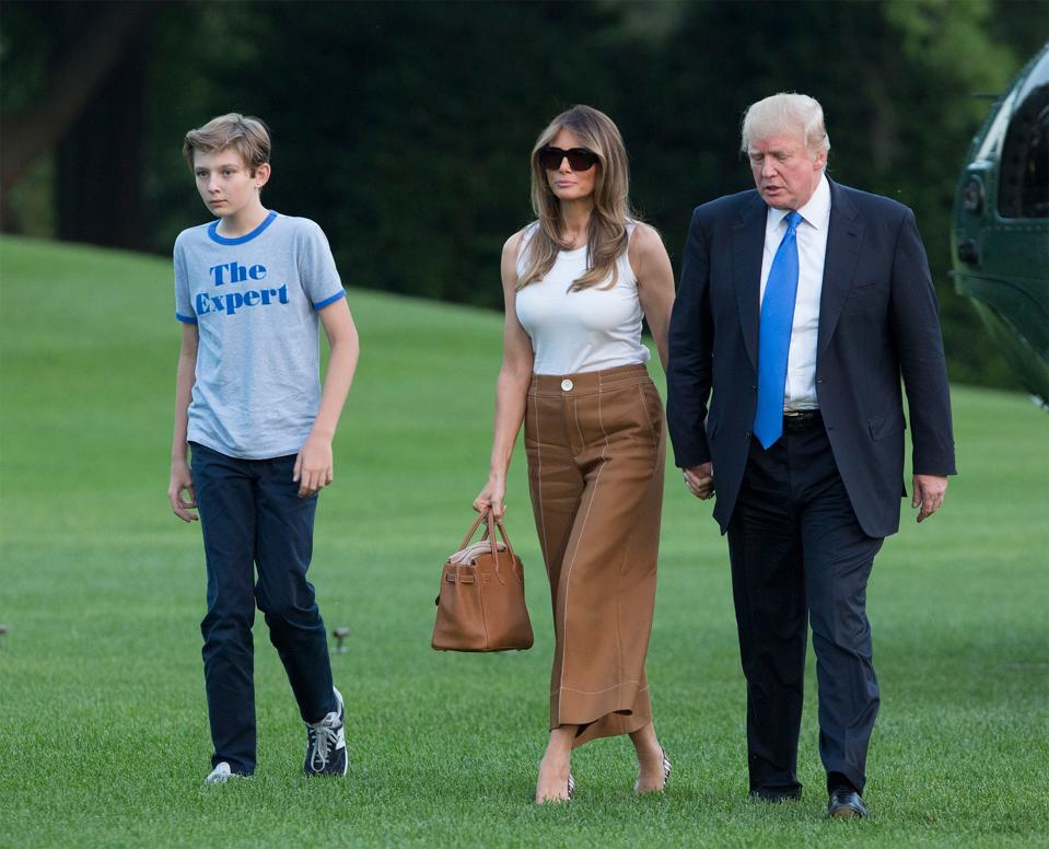 Photo of Barron, Melania and Donald Trump on the White House lawn.