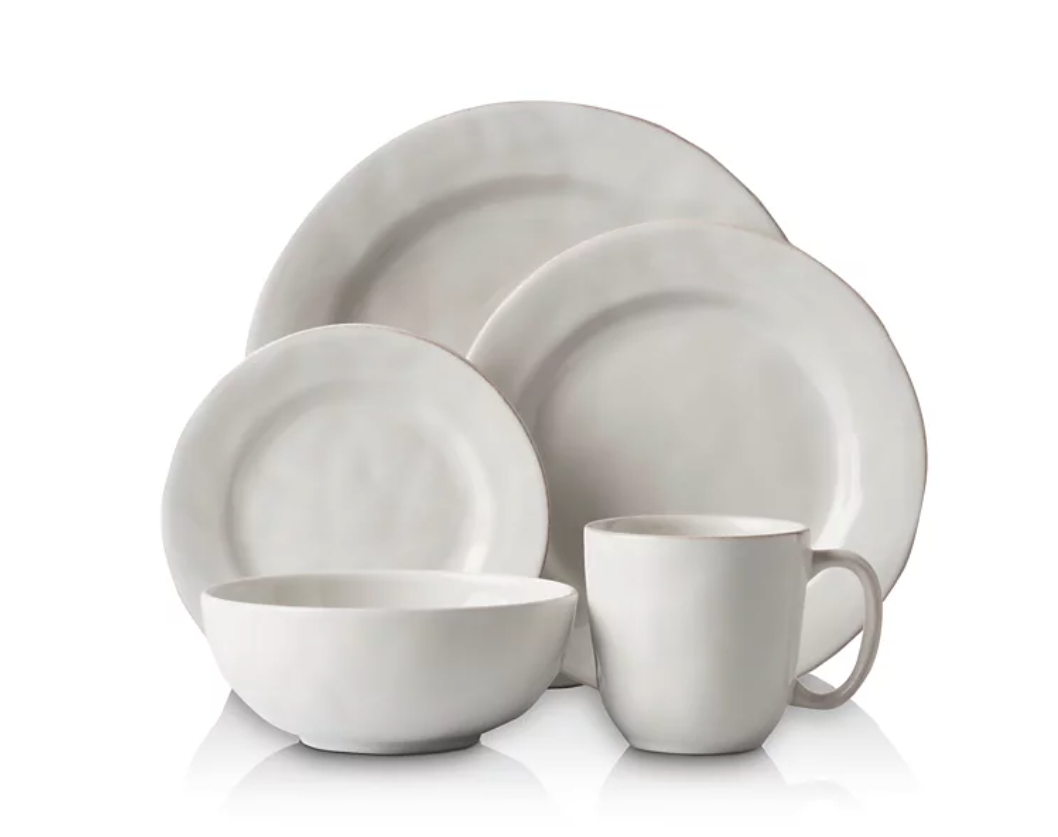 Three plates, a bowl and a mug from the Julika Puro Set on white background