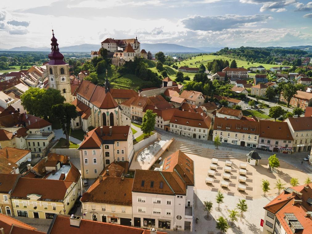 Ptuj in Slovenia Townscape. City Tower, Cathedral and Ptuj Castle. Drone View