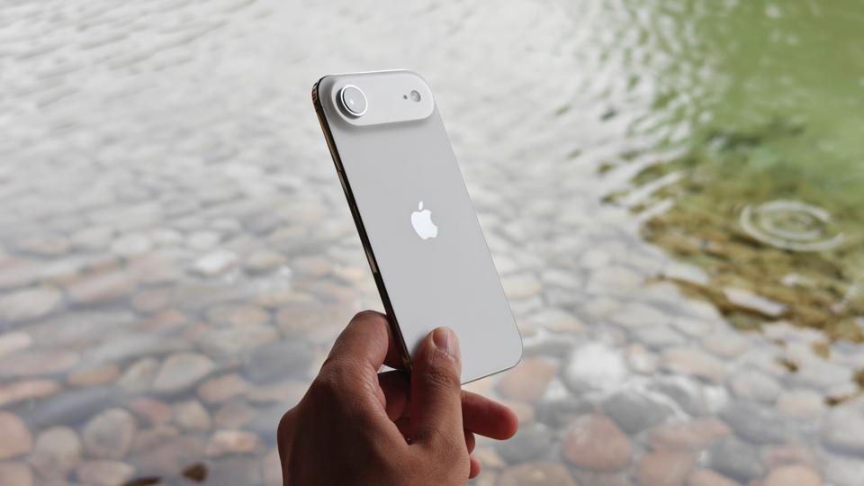 Prakhar Khanna holding the Apple iPhone Air.