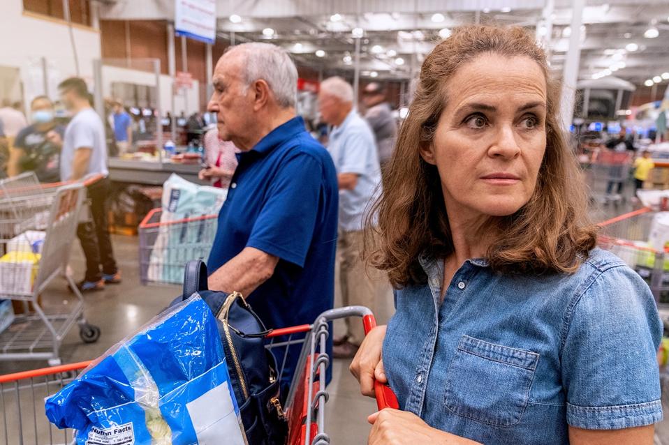 Picture of various people with shopping carts